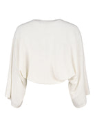 Made by Ester poncho i färgen offwhite - Modevillan